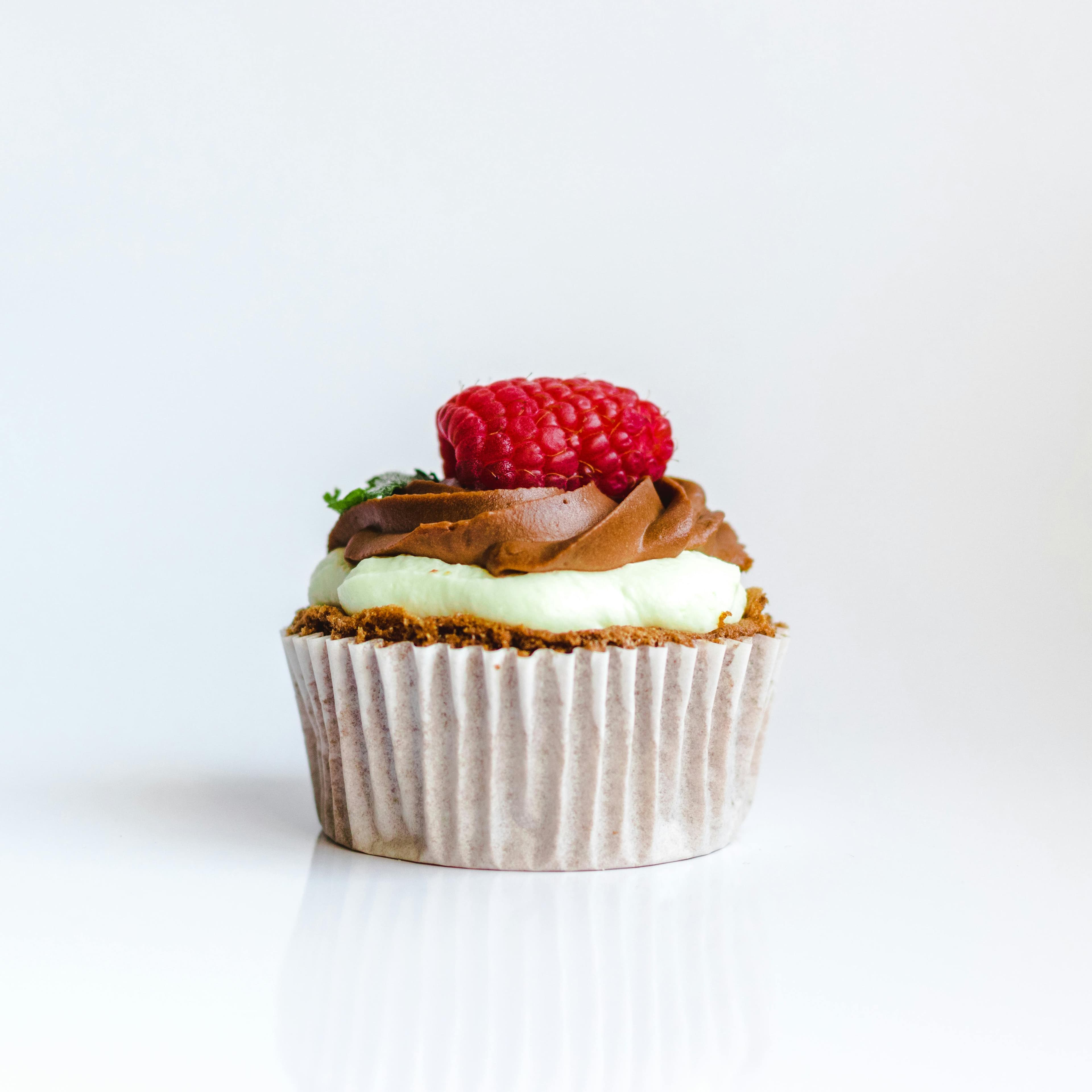 A beautifully decorated cupcake with sprinkles.